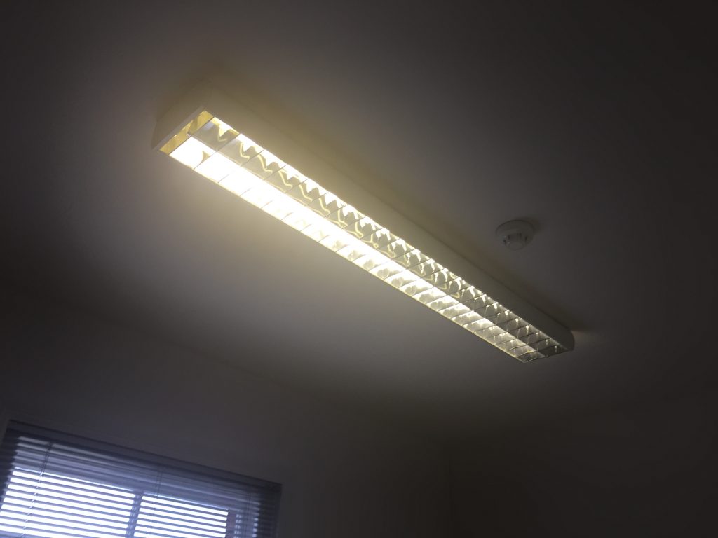 Picture of what the office lighting looked like before the new LED tubes were installed